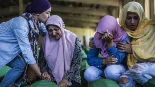Getty Images Family members mourn a victim of the killings in Srebrenica